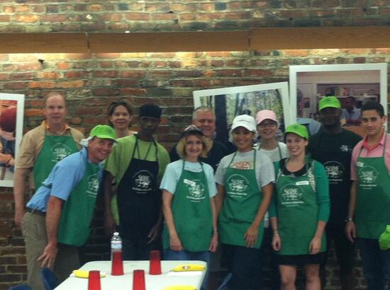 Thanks to SOME for a great day of volunteering! Here's our team with some of their staff members